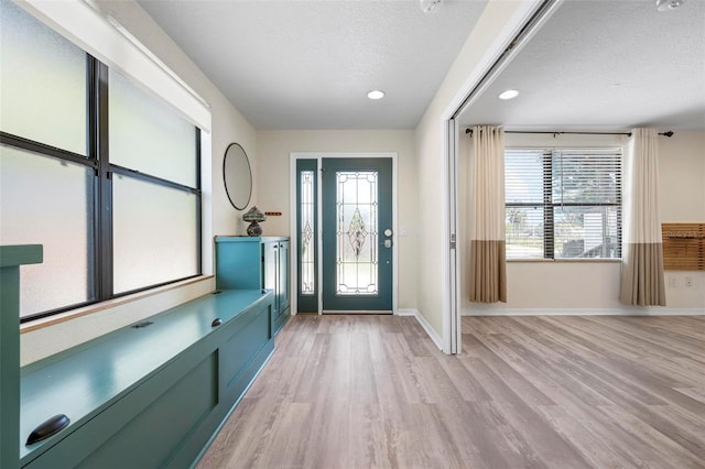6814 68th Ave E, Bradenton, FL 34203 - entrance foyer featuring healthy amount of natural light, a textured ceiling, light wood-type flooring, and recessed lighting
