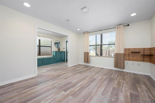 6814 68th Ave E, Bradenton, FL 34203 - spare room with wood finished floors and recessed lighting