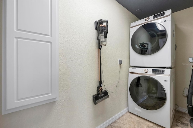 6814 68th Ave E, Bradenton, FL 34203 - laundry room featuring stacked washer and clothes dryer and light tile patterned floors