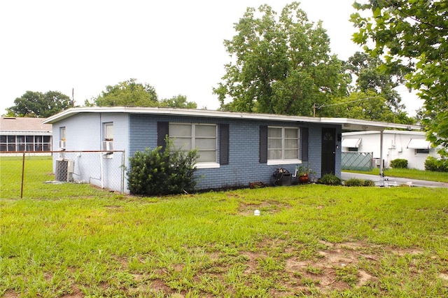 5 Moonlight Ln, Winter Haven, FL 33884 - single story home with brick siding and a carport