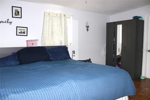 5 Moonlight Ln, Winter Haven, FL 33884 - bedroom with dark tile patterned flooring