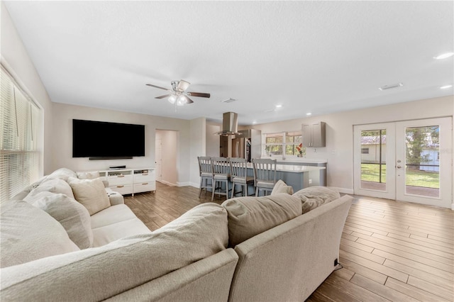 9819 Allen Rd, Lithia, FL 33547 - living room with french doors, wood finished floors, recessed lighting, and ceiling fan