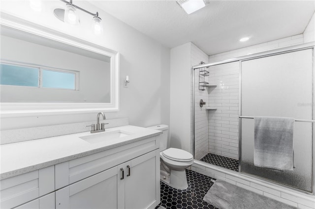 9819 Allen Rd, Lithia, FL 33547 - bathroom with vanity, a shower stall, a textured ceiling, and tile patterned floors