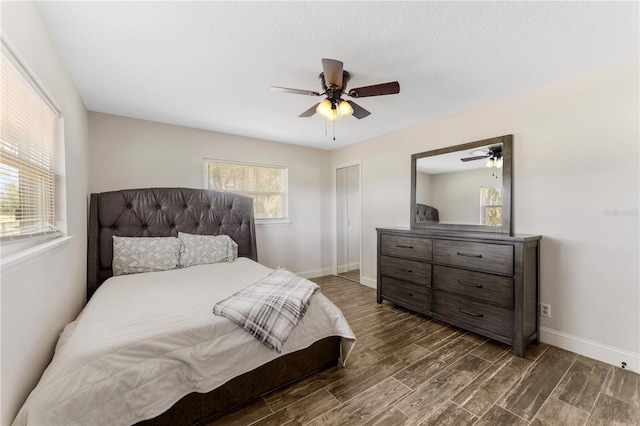 9819 Allen Rd, Lithia, FL 33547 - bedroom featuring dark wood-style flooring, a ceiling fan, and a closet
