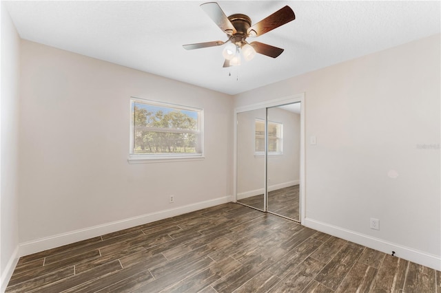 9819 Allen Rd, Lithia, FL 33547 - unfurnished bedroom with wood finished floors, a closet, and a ceiling fan