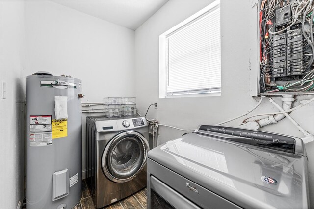 9819 Allen Rd, Lithia, FL 33547 - laundry area featuring electric water heater, electric panel, washer and clothes dryer, and wood finished floors