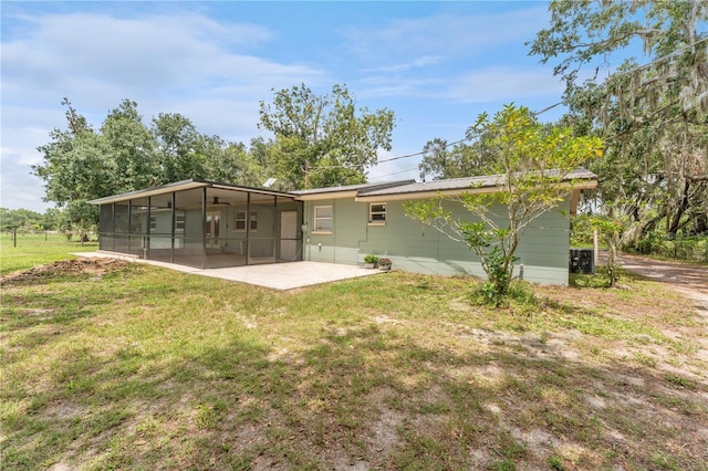 9819 Allen Rd, Lithia, FL 33547 - back of property featuring a sunroom, a yard, and a patio