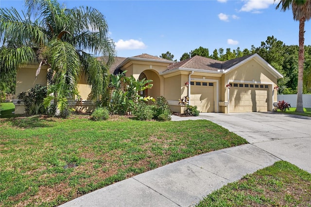 1835 Fircrest Ct, Wesley Chapel, FL 33543 - view of front of home featuring an attached garage, stucco siding, and concrete driveway