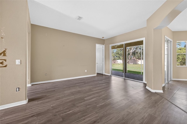 1835 Fircrest Ct, Wesley Chapel, FL 33543 - spare room featuring plenty of natural light and dark wood-style flooring