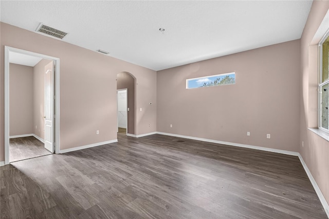 1835 Fircrest Ct, Wesley Chapel, FL 33543 - unfurnished room with arched walkways and wood finished floors