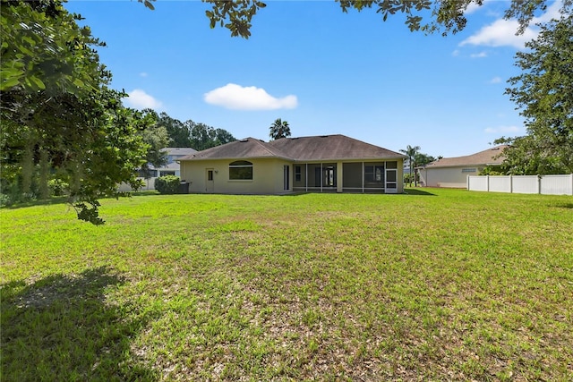 1835 Fircrest Ct, Wesley Chapel, FL 33543 - back of property featuring a sunroom and stucco siding