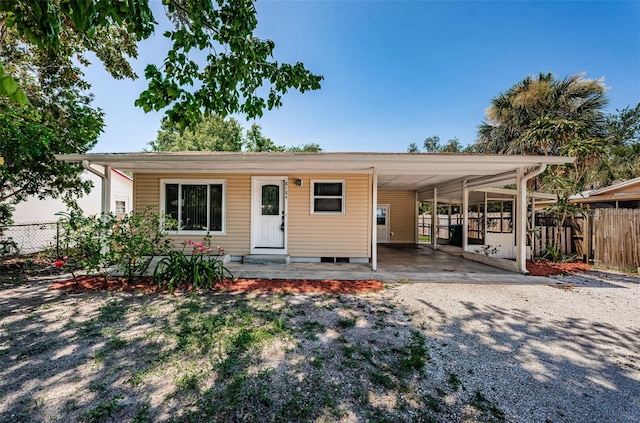 8184 49th Ave N, Saint Petersburg, FL 33709 - view of front of property featuring gravel driveway and a carport