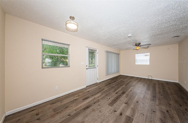 8184 49th Ave N, Saint Petersburg, FL 33709 - unfurnished room with wood finished floors, ceiling fan, and a textured ceiling