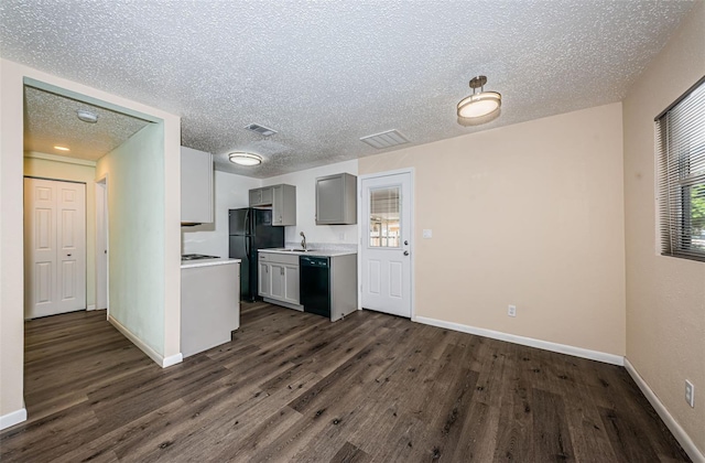 8184 49th Ave N, Saint Petersburg, FL 33709 - kitchen with black appliances, gray cabinets, light countertops, dark wood finished floors, and a textured ceiling