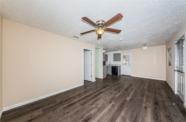 8184 49th Ave N, Saint Petersburg, FL 33709 - unfurnished living room with dark wood-style flooring, a textured ceiling, and ceiling fan