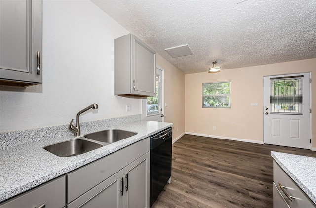 8184 49th Ave N, Saint Petersburg, FL 33709 - kitchen with gray cabinetry, dishwasher, a textured ceiling, dark wood finished floors, and light stone counters