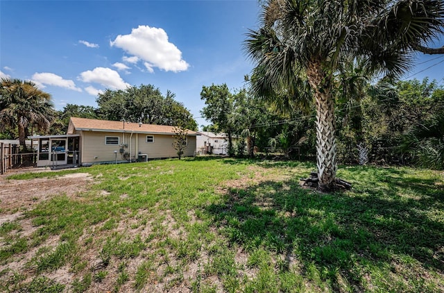 8184 49th Ave N, Saint Petersburg, FL 33709 - fenced backyard featuring a sunroom