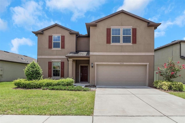 1613 Cabbage Key Dr, Ruskin, FL 33570 - traditional-style house with stucco siding, a garage, concrete driveway, and a front lawn