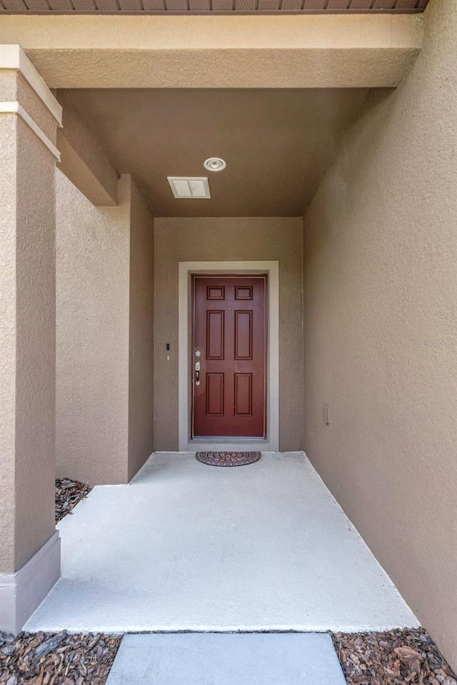 1613 Cabbage Key Dr, Ruskin, FL 33570 - view of exterior entry with stucco siding