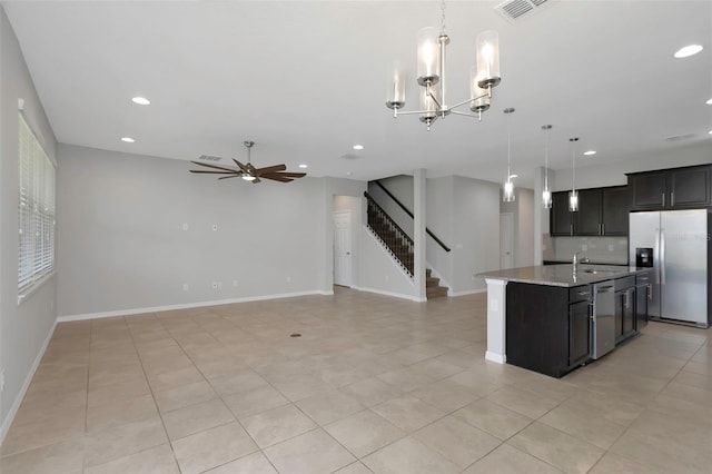 1613 Cabbage Key Dr, Ruskin, FL 33570 - kitchen with appliances with stainless steel finishes, a ceiling fan, recessed lighting, a kitchen island with sink, and open floor plan