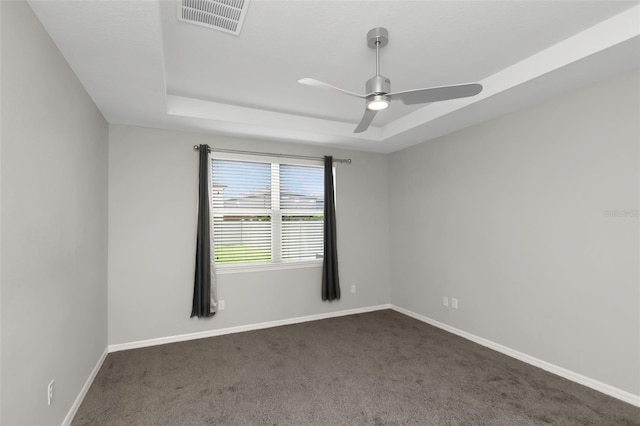 1613 Cabbage Key Dr, Ruskin, FL 33570 - unfurnished room with a raised ceiling, dark colored carpet, and ceiling fan