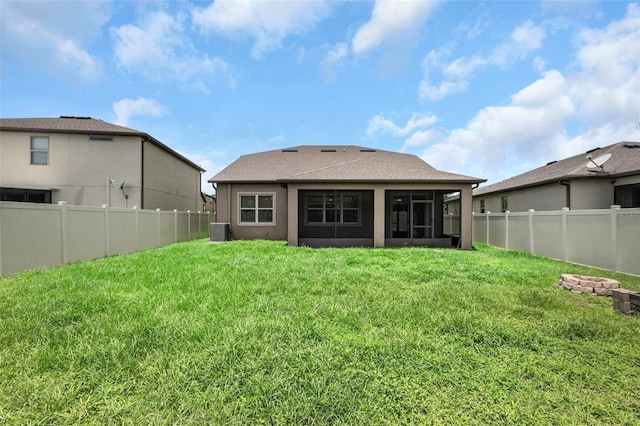 1613 Cabbage Key Dr, Ruskin, FL 33570 - rear view of property with a sunroom and a fenced backyard