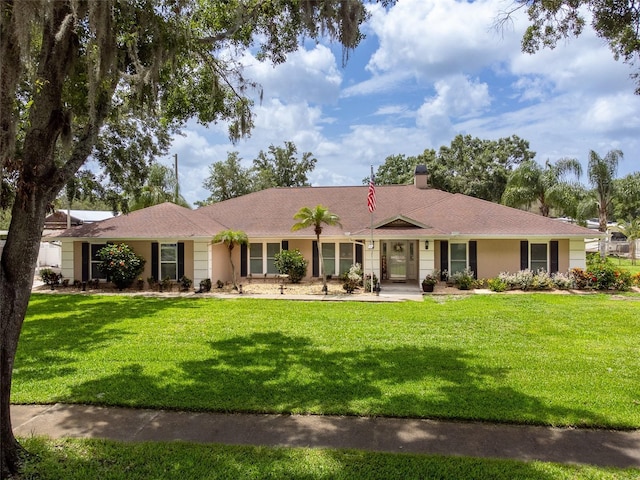 10502 Lake Williams Dr, Odessa, FL 33556 - single story home with a front lawn and a chimney