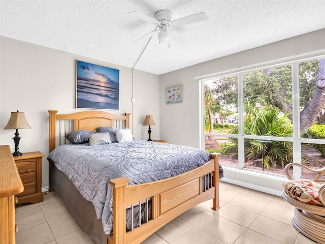 401 Windrush Bay Dr, Tarpon Springs, FL 34689 - bedroom with a textured ceiling, light tile patterned floors, and ceiling fan