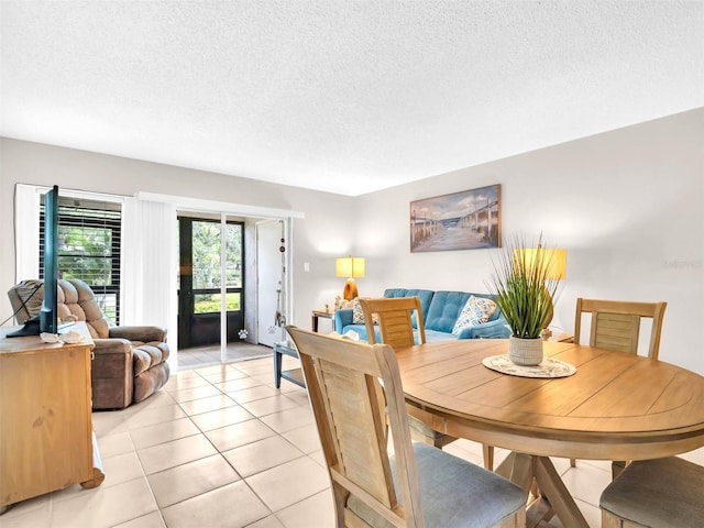 401 Windrush Bay Dr, Tarpon Springs, FL 34689 - dining room featuring light tile patterned floors and a textured ceiling