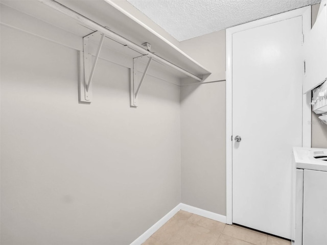 401 Windrush Bay Dr, Tarpon Springs, FL 34689 - walk in closet featuring light tile patterned floors