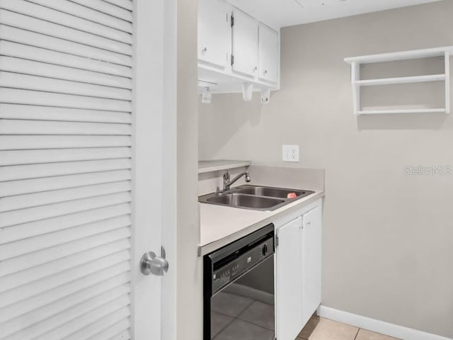 401 Windrush Bay Dr, Tarpon Springs, FL 34689 - kitchen with dishwasher, white cabinets, light tile patterned floors, and light countertops