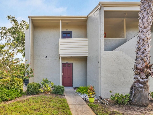 401 Windrush Bay Dr, Tarpon Springs, FL 34689 - doorway to property featuring stucco siding