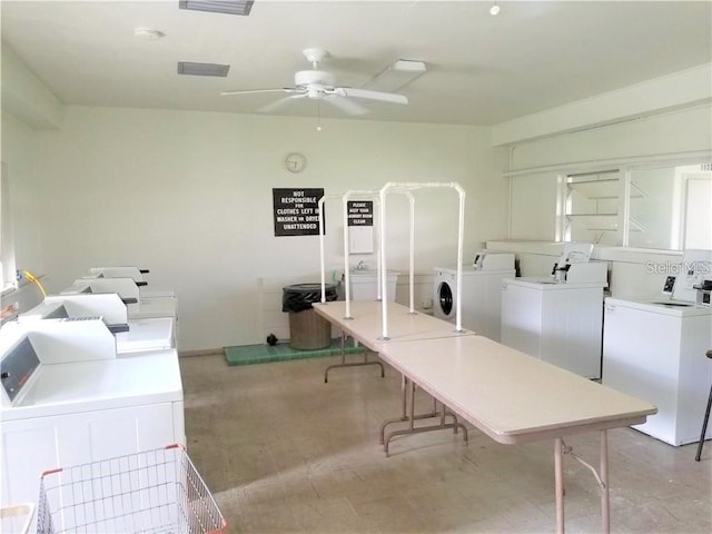 401 Windrush Bay Dr, Tarpon Springs, FL 34689 - community laundry room with washing machine and clothes dryer and a ceiling fan