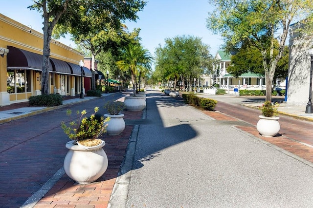 401 Windrush Bay Dr, Tarpon Springs, FL 34689 - view of road with sidewalks, street lights, and curbs