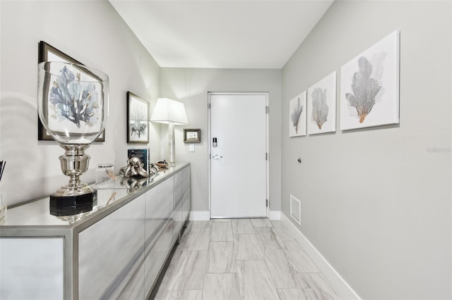 415 Island Way Unit 507, Clearwater Beach, FL 33767 - entryway with baseboards and light marble finish flooring