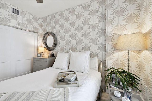 415 Island Way Unit 507, Clearwater Beach, FL 33767 - bedroom with wallpapered walls