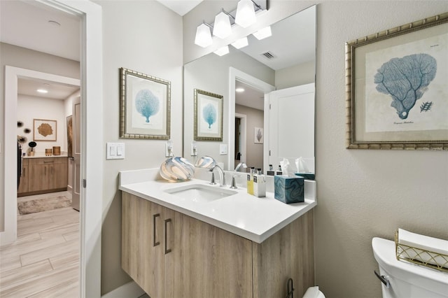 415 Island Way Unit 507, Clearwater Beach, FL 33767 - bathroom featuring vanity and wood finished floors