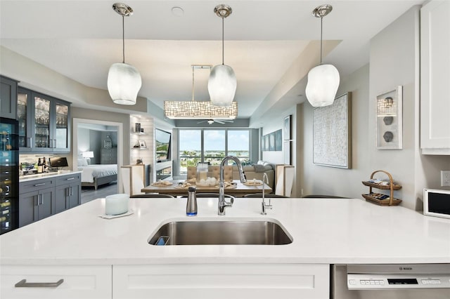 415 Island Way Unit 507, Clearwater Beach, FL 33767 - kitchen with dishwasher, open floor plan, and light countertops