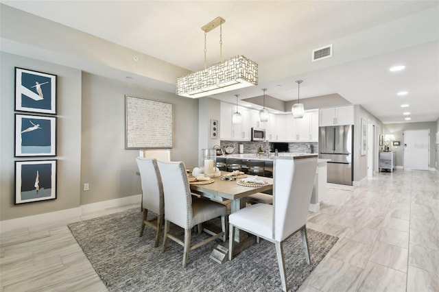 415 Island Way Unit 507, Clearwater Beach, FL 33767 - dining room featuring baseboards and recessed lighting