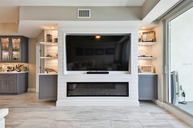 415 Island Way Unit 507, Clearwater Beach, FL 33767 - living room featuring heating unit and a fireplace