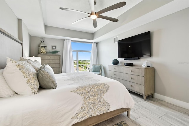 415 Island Way Unit 507, Clearwater Beach, FL 33767 - bedroom with a raised ceiling and a ceiling fan