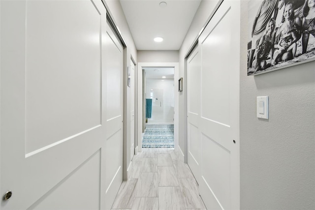 415 Island Way Unit 507, Clearwater Beach, FL 33767 - hall featuring light marble finish flooring and recessed lighting