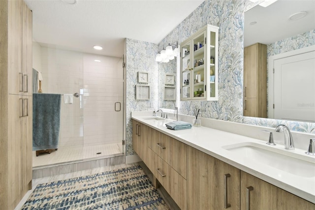 415 Island Way Unit 507, Clearwater Beach, FL 33767 - full bath with wallpapered walls, a stall shower, double vanity, and tile patterned flooring