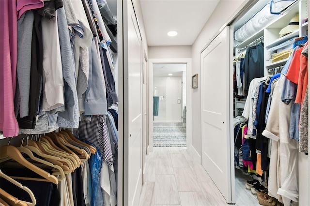 415 Island Way Unit 507, Clearwater Beach, FL 33767 - walk in closet featuring marble finish floors