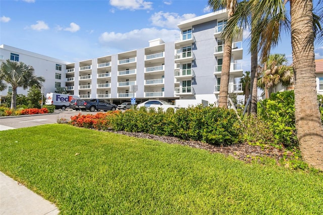 415 Island Way Unit 507, Clearwater Beach, FL 33767 - view of apartment building / complex featuring uncovered parking
