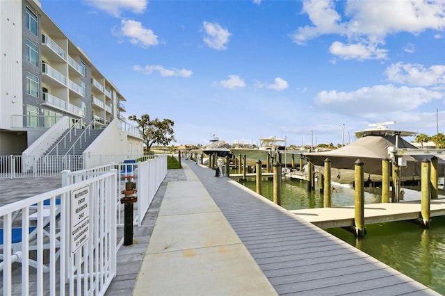 415 Island Way Unit 507, Clearwater Beach, FL 33767 - dock area featuring boat lift and a water view