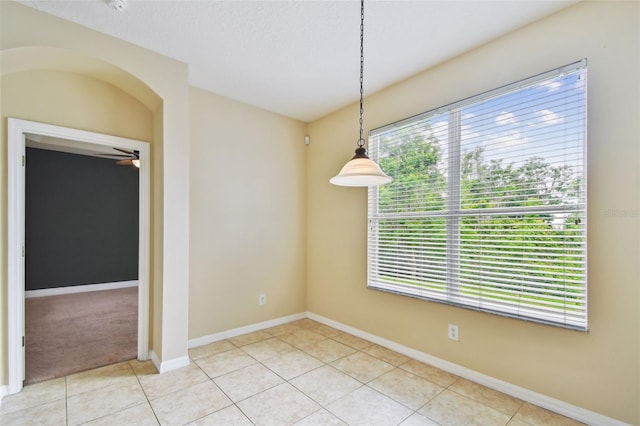 297 Beacon Pointe Dr, Ocoee, FL 34761 - unfurnished dining area featuring light tile patterned flooring and ceiling fan