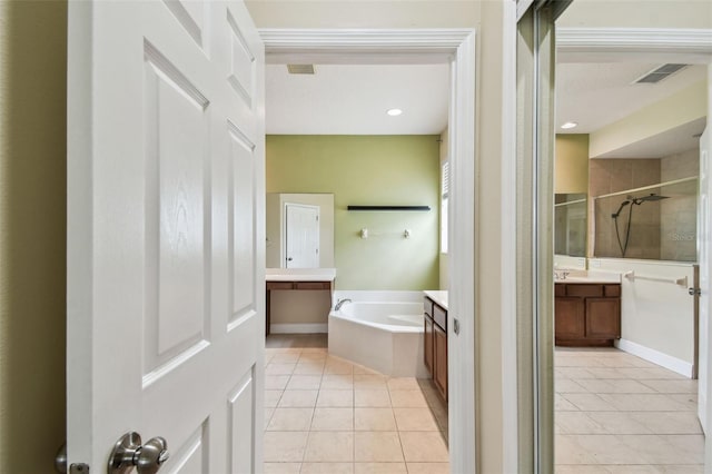 297 Beacon Pointe Dr, Ocoee, FL 34761 - full bathroom featuring vanity, tile patterned floors, a stall shower, and a bath