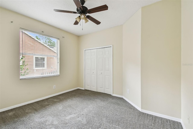 297 Beacon Pointe Dr, Ocoee, FL 34761 - unfurnished bedroom with carpet flooring, a closet, and ceiling fan