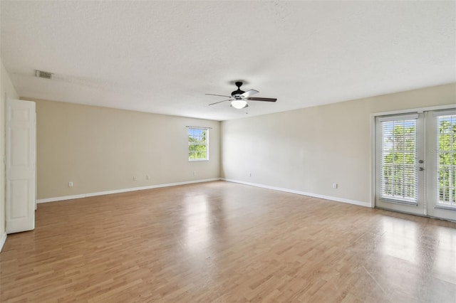 297 Beacon Pointe Dr, Ocoee, FL 34761 - unfurnished room featuring a ceiling fan and light wood-type flooring